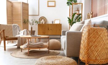 A living room with cozy, trendy furniture, a couch, coffee table, chair, and cabinet for blog post places to sell furniture online