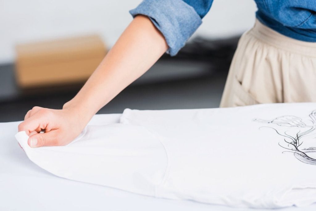 Woman uses Cricut to print a custom-designed T-shirt