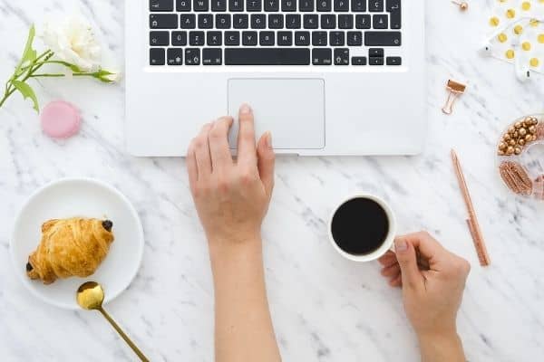 Woman reading emails on laptop computer.