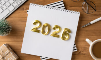 A desk scene for year end and holiday plans with a 2026 calendar, gift, coffee, and office items for best work from home jobs 2026