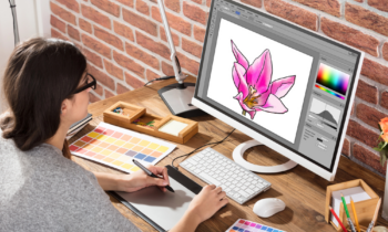 A female graphic designer using Photoshop to create digital designs