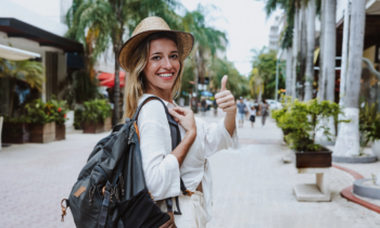 A female tour guide who is getting paid to walk