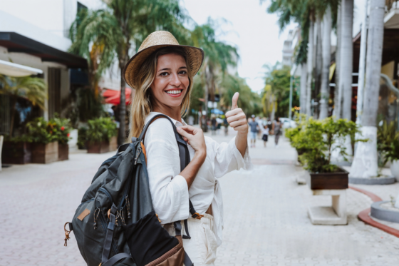 A female tour guide who is getting paid to walk