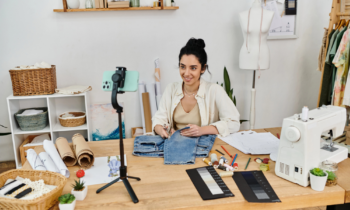 A woman using a smal machine to make money from home