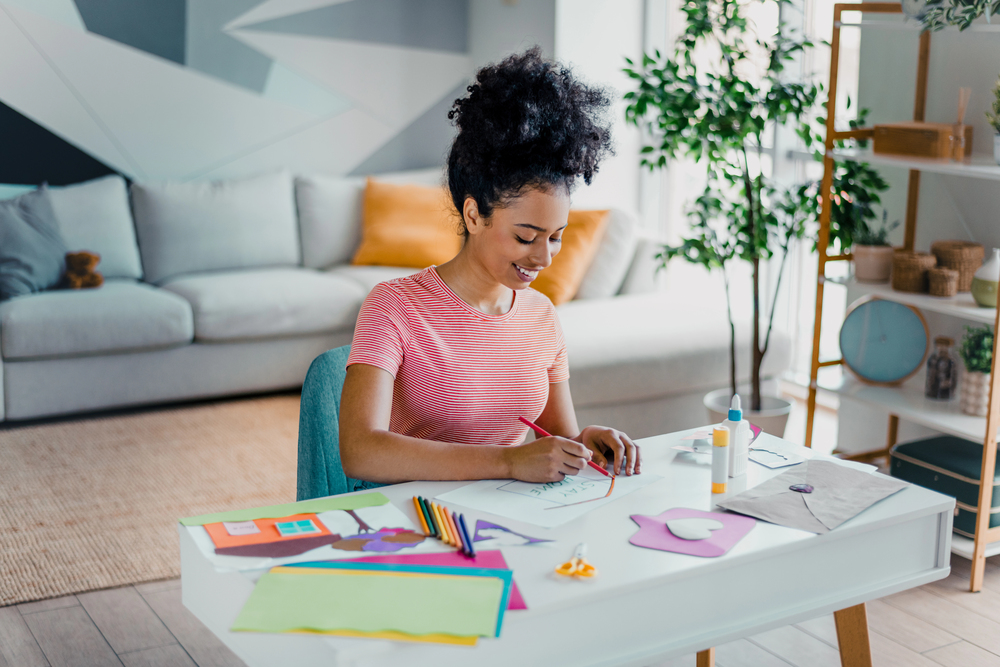 A young woman making crafts to sell online to make money online