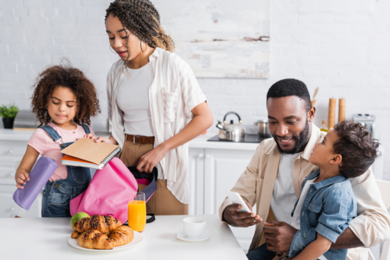 African american mother and daughter packing backpack before school for blog post jobs during school hours