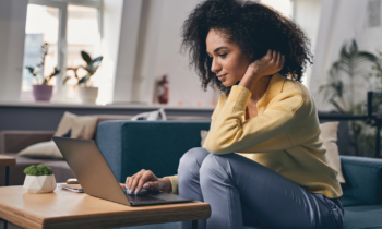 Concentrated woman staring at the laptop screen looking for legit jobs you can do from home