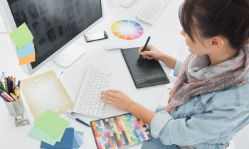 Woman working on a graphic design project in her home office