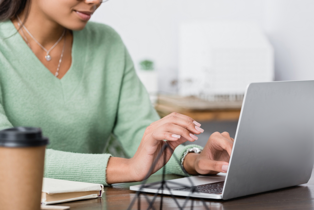 Nurse working from home on laptop