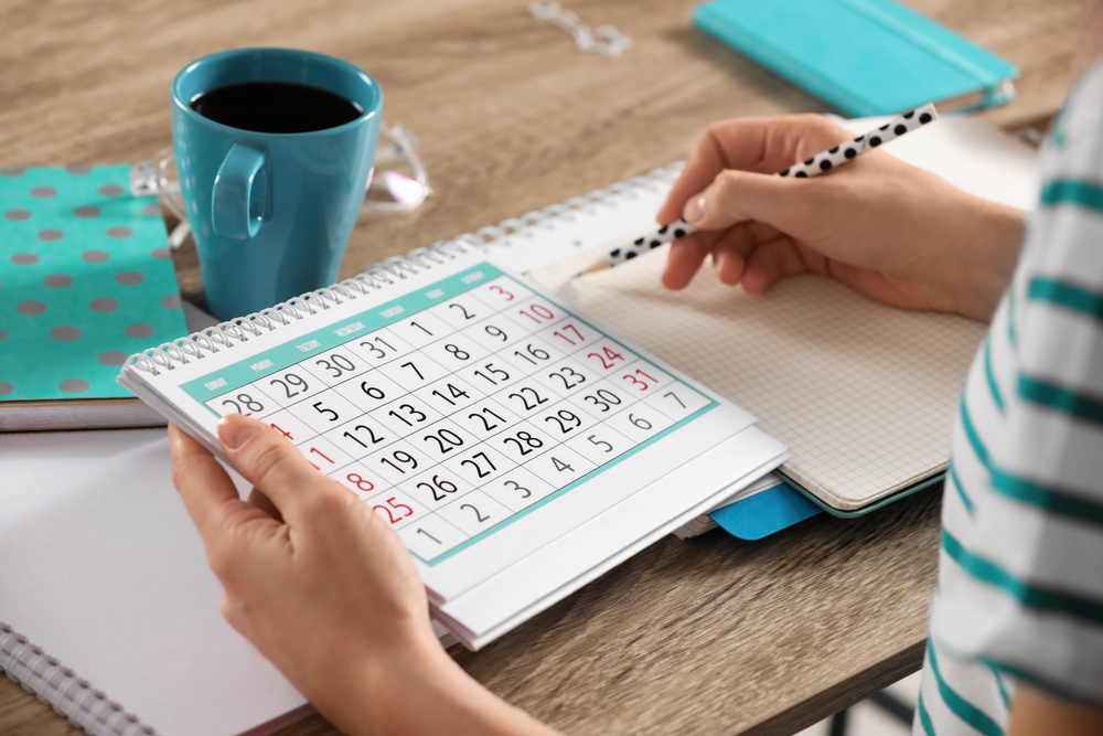 Woman researching the best work from home jobs for 2024 while drinking coffee