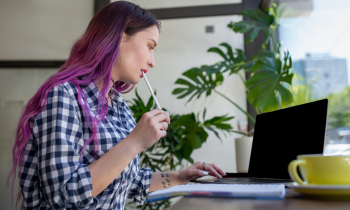 college student working online to make money has long purple hair - for blog post online jobs for college students