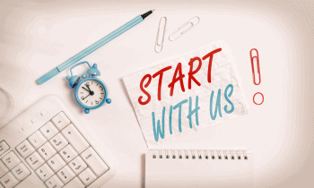 desk with the words start with us!